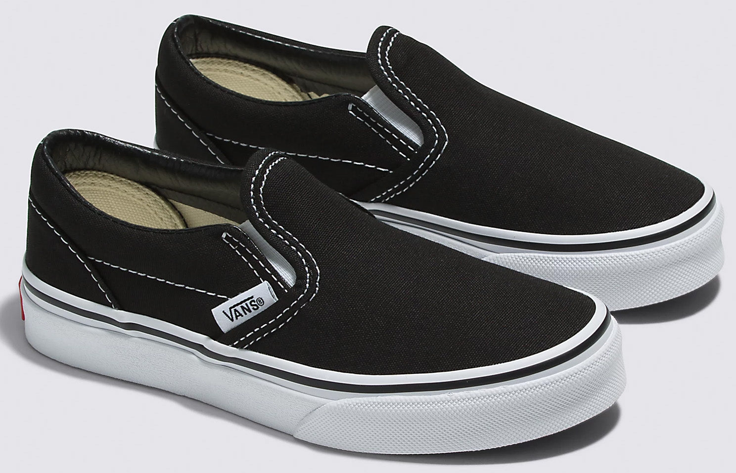 All black slip on vans kids best sale