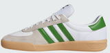 White Adidas sneaker with green stripes on a white background